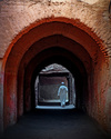 Man walking through arches, Marrakech